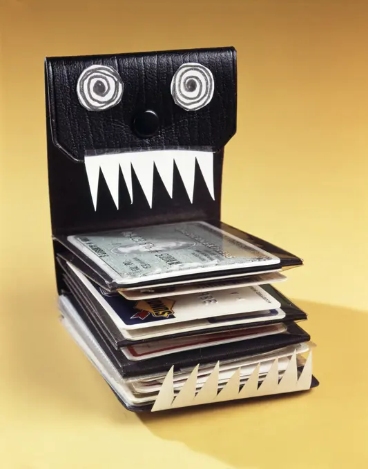 1960s WALLET FILLED WITH CREDIT CARDS DECORATED LIKE MONSTER EYES TEETH DEBT