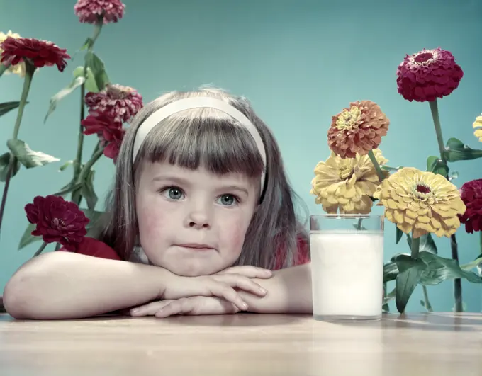 1950S Cute Thoughtful Girl Bangs White Headband Leaning Arms & Head On Table Glass Of Milk Flowers Zinnias Behind