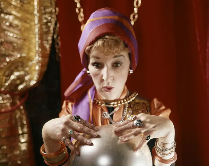 1960S Female Gypsy Fortune Teller Looking Into Crystal Ball