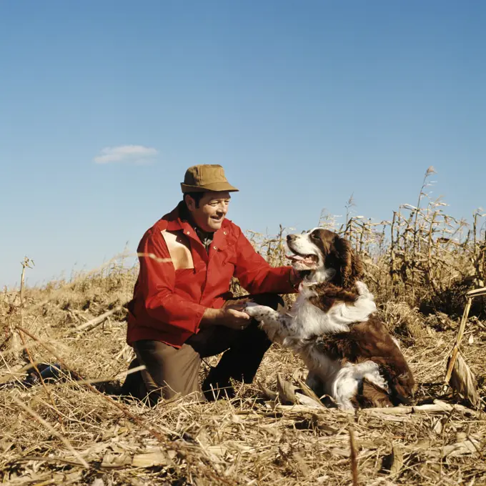 1970S Man Hunter In Field With His Dog