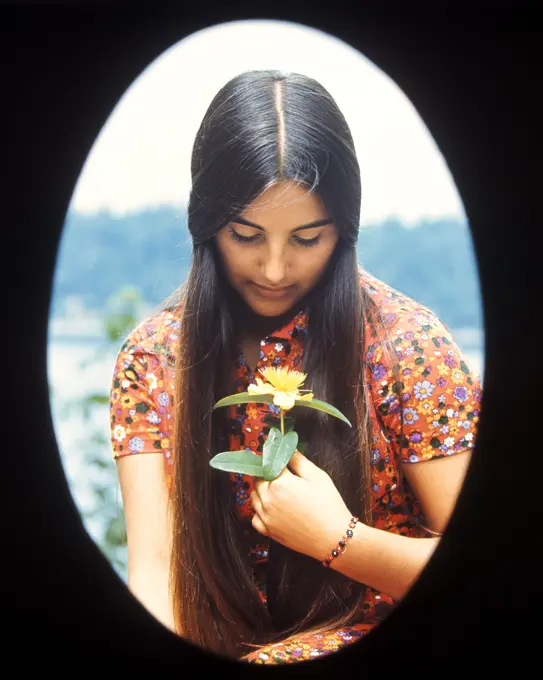 1970S Oval Vignette Teen Teenage Teenager Girl Moody Expression Holding Yellow Flower