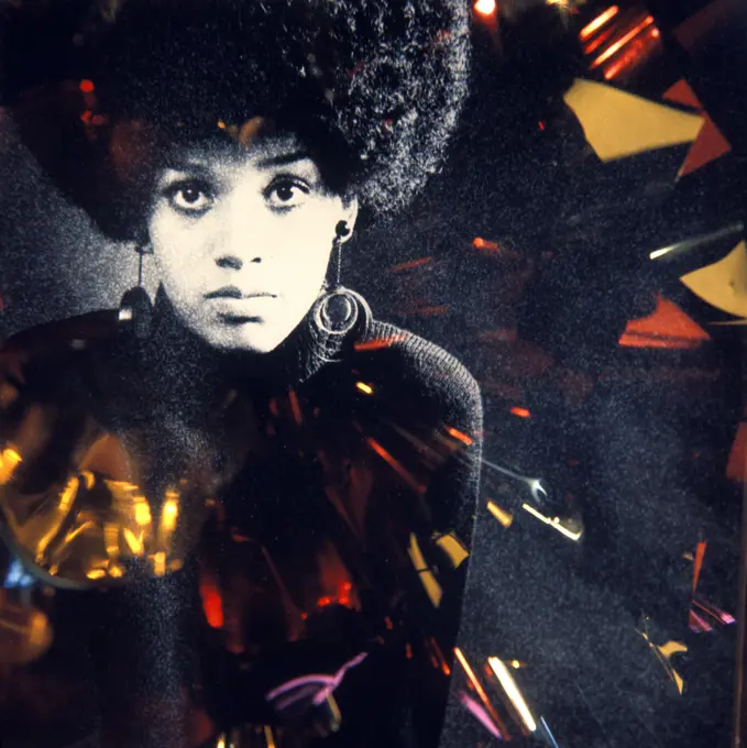 1960S 1970S Fashion Portrait Serious African American Woman Large Afro Hair Style Hoop Earrings Special Effect Lighting