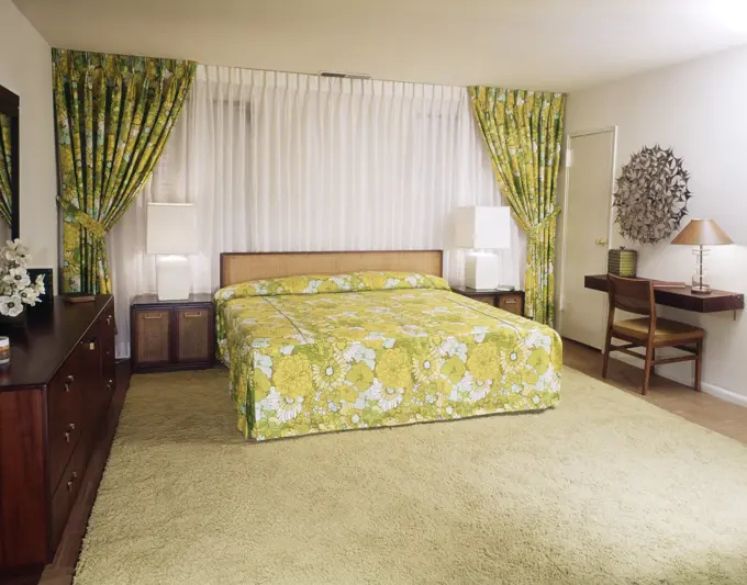 1970S Bedroom With Green And Yellow Flowered Bedspread And Drapes