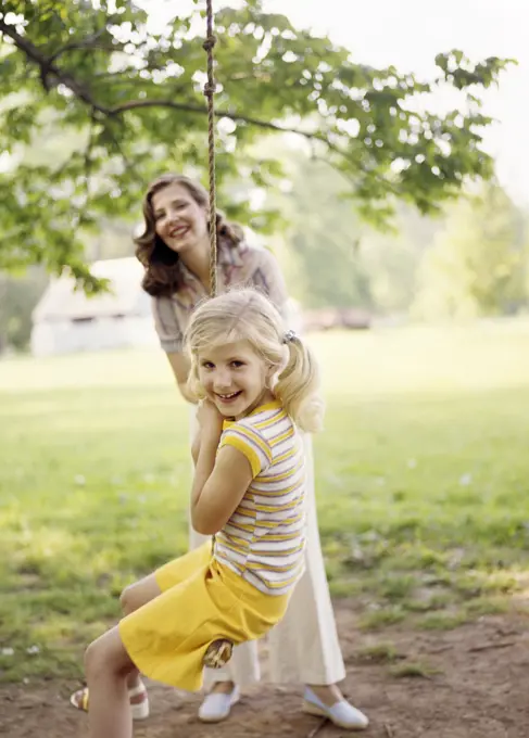 1970S Smiling Woman Mother With Girl Daughter Swinging Playing On Rope Swing