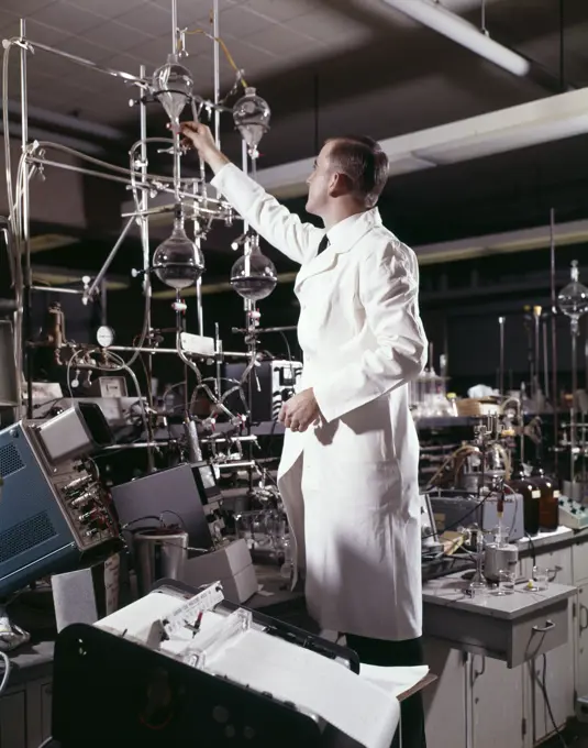 1960S Laboratory Technician Conducting A Titration Test Science Experiment Elaborate Precision