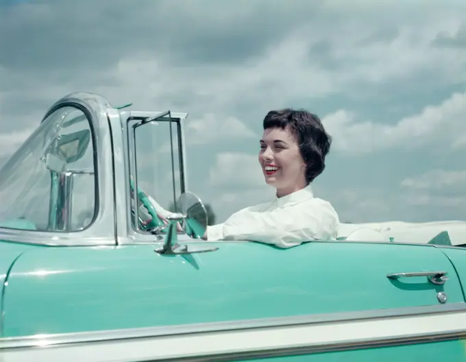 1950S Smiling Brunette Woman Driving Turquoise And White 1955 Chevrolet Convertible Automobile