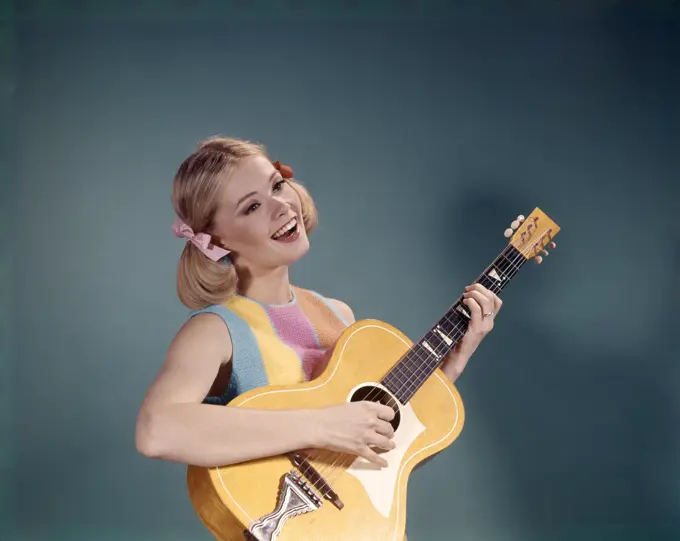 1960S Young Girl Playing Guitar