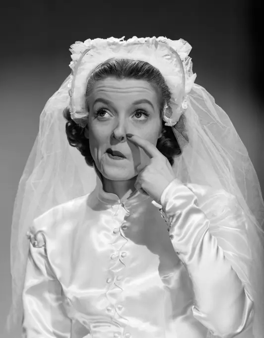 1950S Bride Scratching Nose And Looking Up