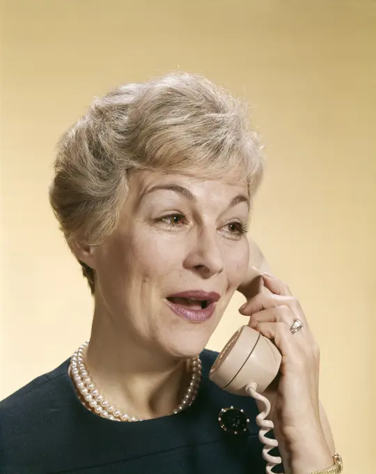 1960S Smiling Happy Senior Woman Talking On Telephone