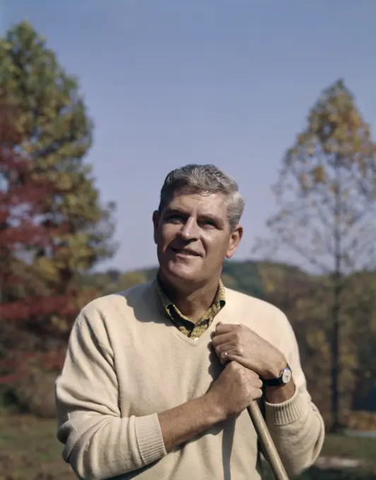 1960S Portrait Man Raking Yard Work Leaves