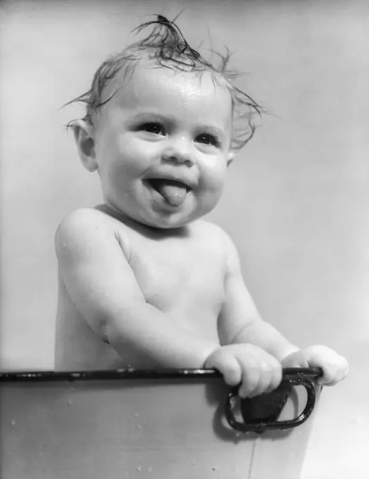 1940S 1930S Wet Baby Sitting In Tub Sticking Out Tongue