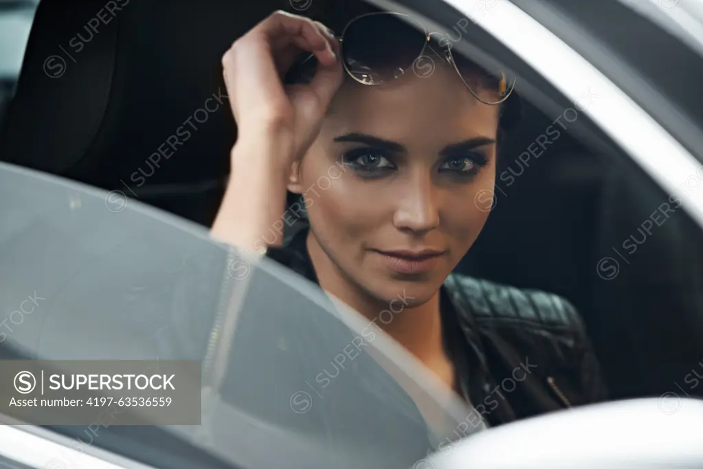 Woman, car and portrait while driving for a roadtrip commute in a luxury vehicle. Female person, face and window of a transportation motor for trip with confidence to travel destination