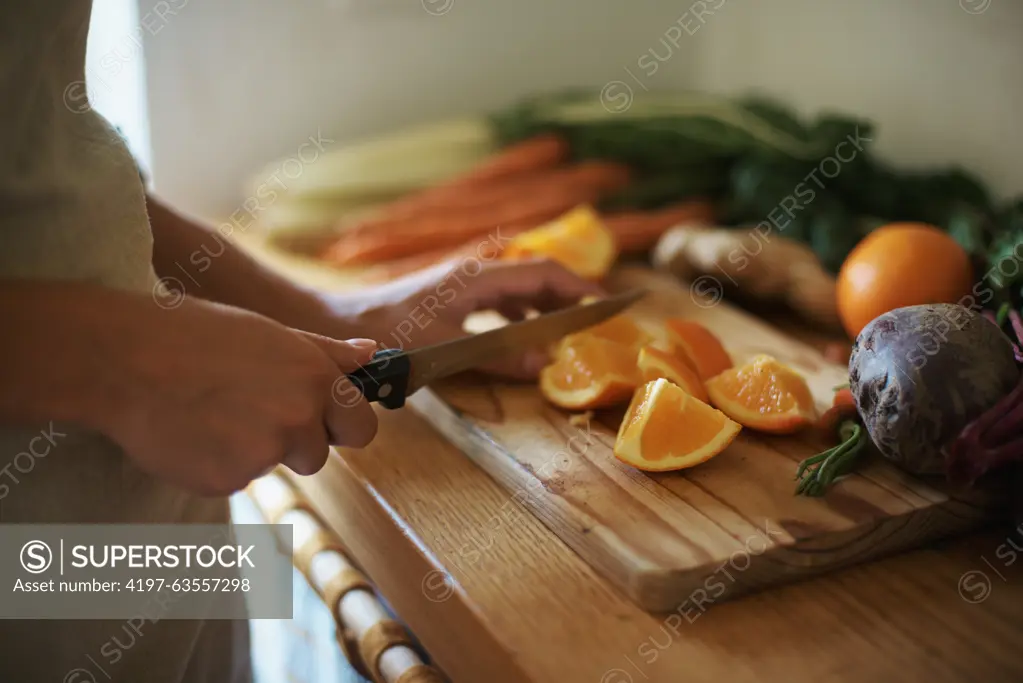 Closeup, kitchen and fruits with woman, vegetables and chopping board with knife and salad. Person, vegan and chef with utensils and ingredients for lunch and supper with healthy meal and diet plan