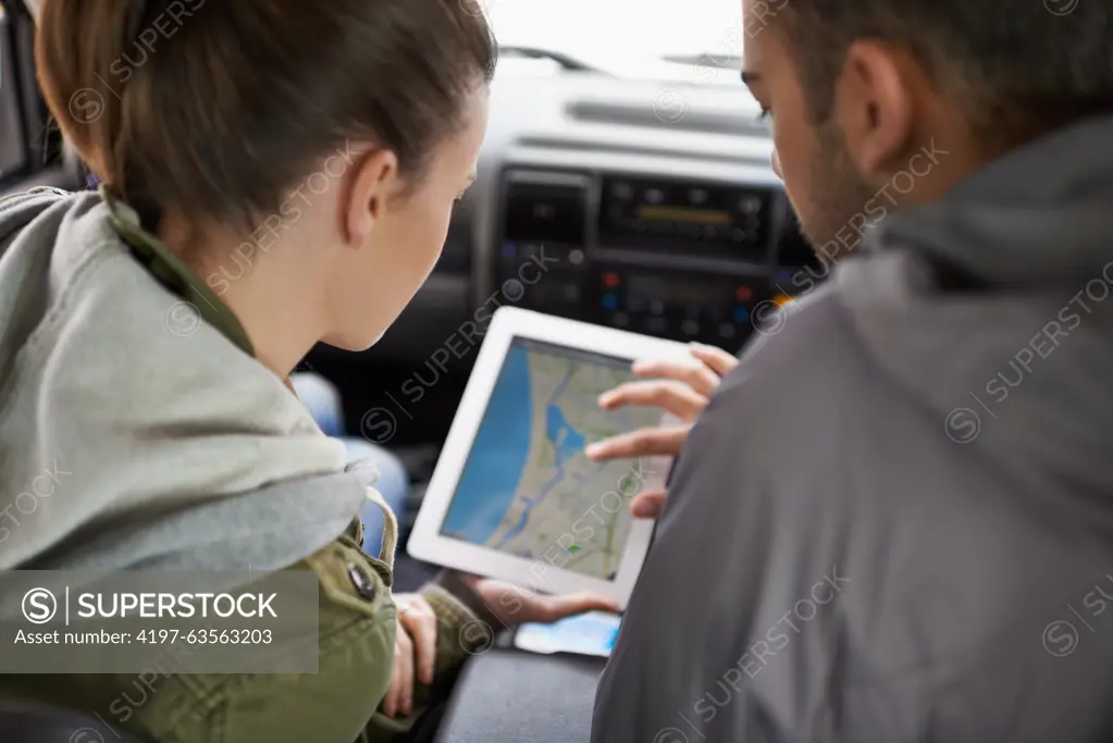 Couple, car and map on road trip with navigation for direction, vacation and travel to destination in countryside. Woman, man and tablet in vehicle for tech or location to holiday journey and tourism