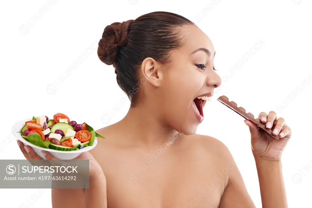 Happy woman, salad and chocolate with choice for diet, nutrition or healthy balance on a white studio background. Female person, brunette or model in decision for dessert or bowl of vegetables to eat