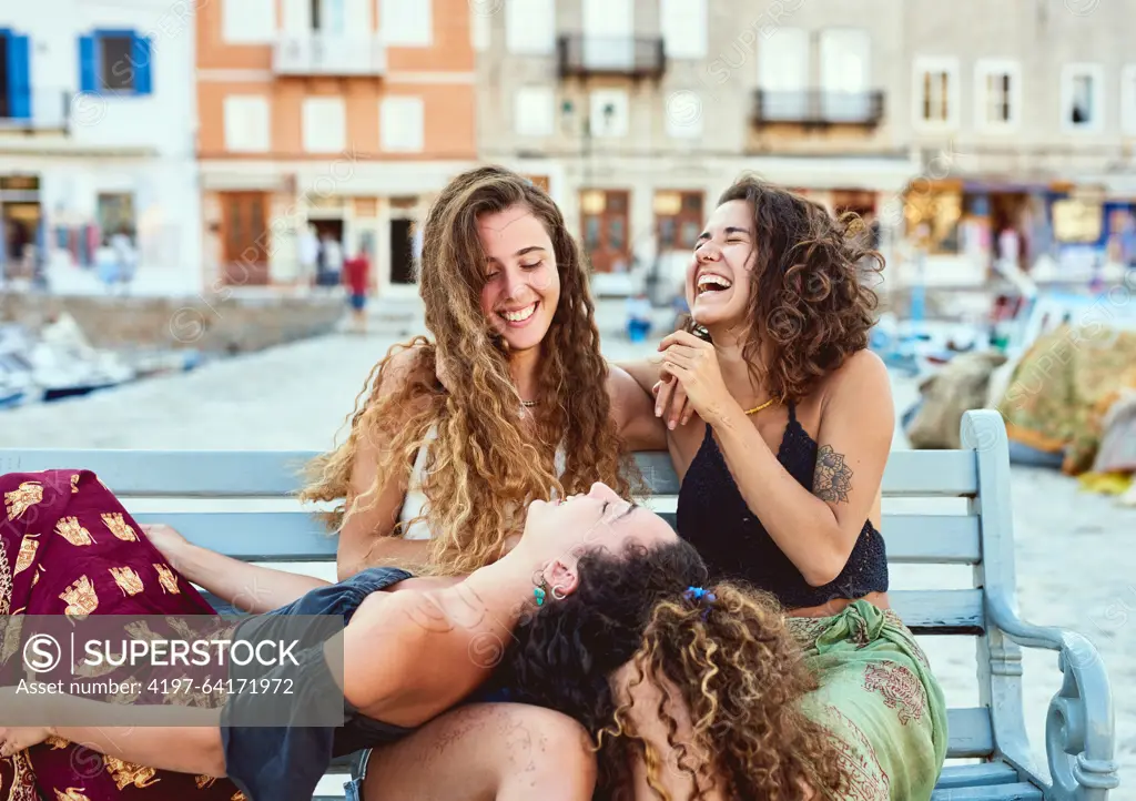 Happy, conversation and women in city for holiday, summer vacation and adventure together. Laughing, travel and friends talking, chatting and relax for journey, bonding and tourism in Barcelona