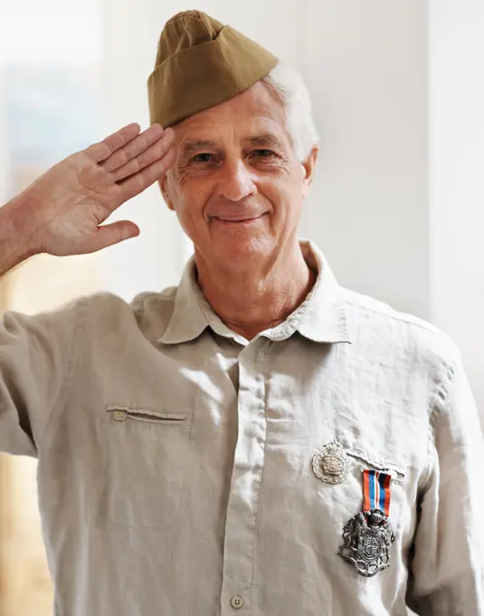 Mature man, war and hero in retirement with service, medals and uniform as soldier or patriot.Senior person, army and veteran in portrait for memories, pride and respect in salute for remembering