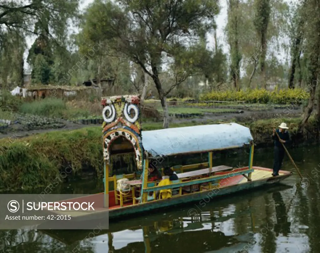 Tourists boating in a lake, Xochimilco Gardens, Xochimilco, Mexico City, Mexico