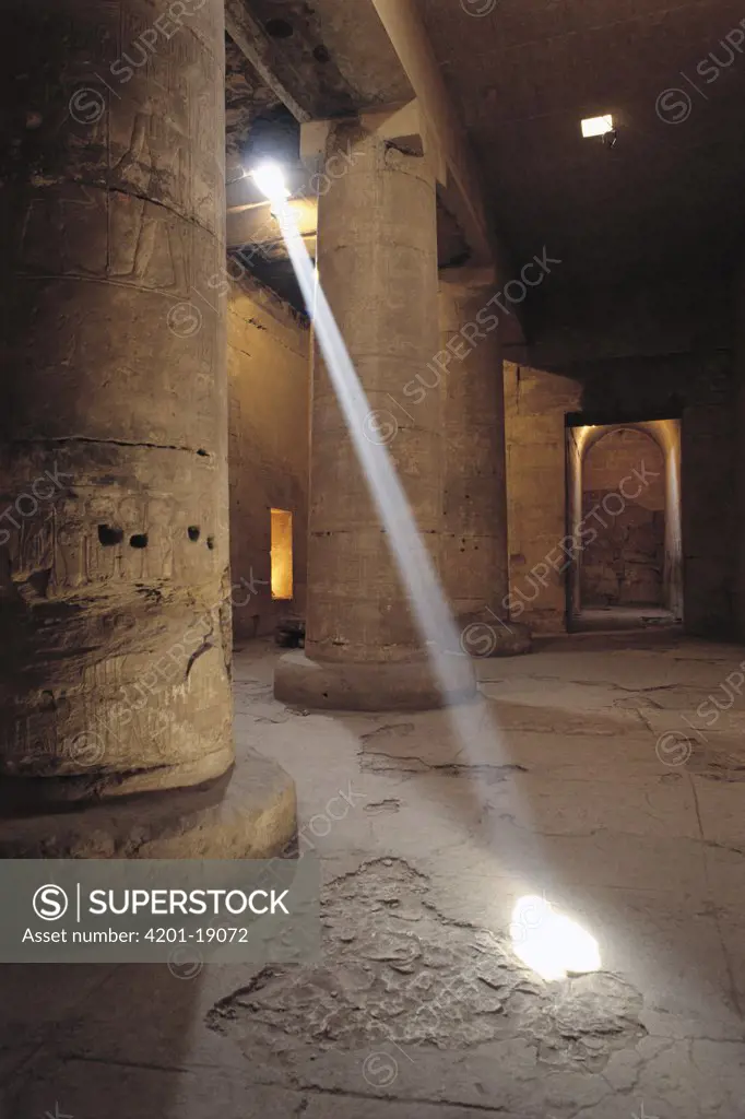 Sunlight shafts pierce the Temple of Abydos, Luxor, Egypt