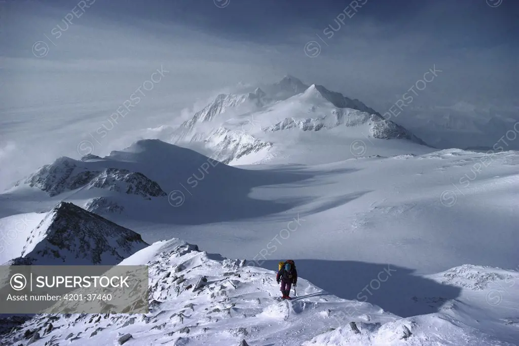 Mountain climber approaching summit of Vinson Massif, the highest peak in Antarctica, Ellsworth Mountains, Antarctica