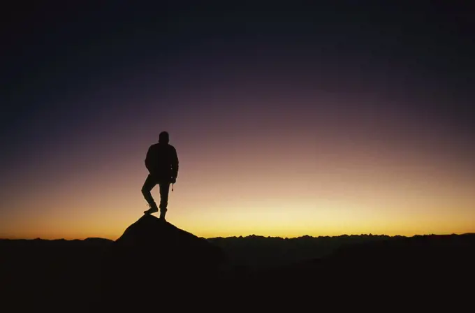 Hiker at sunset, Cordillera Blanca, Peru