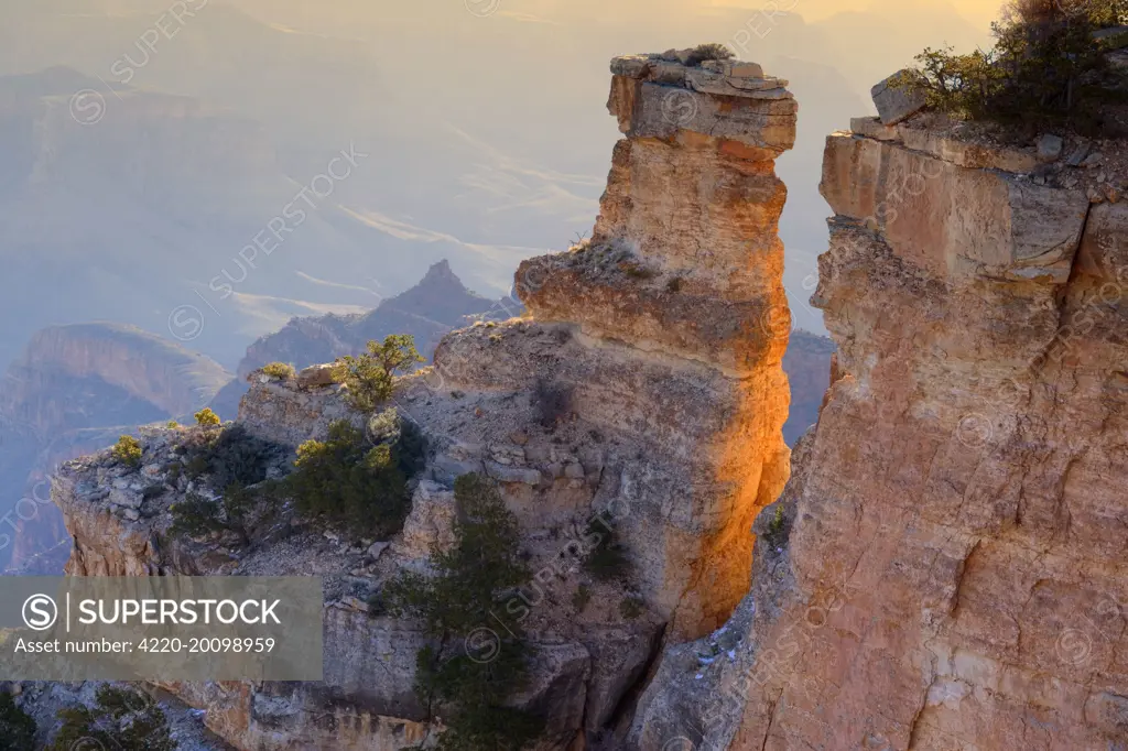 Grand Canyon - rock formation in the shape of a turret and panoramic view from Yaki Point into the Grand Canyon at sunrise. Grand Canyon National Park - South Rim - Arizona - USA .