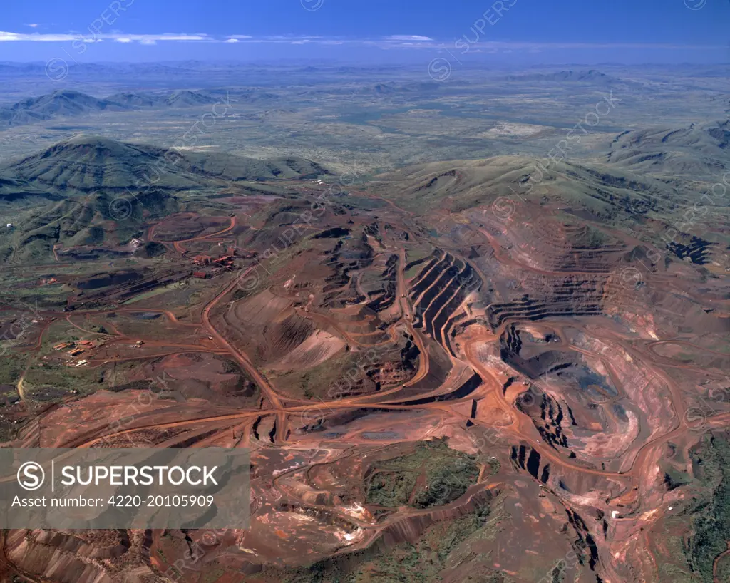 Aerial - Tom Price iron ore-open cut mine Hamersley Range. Pilbara Region, Western Australia.