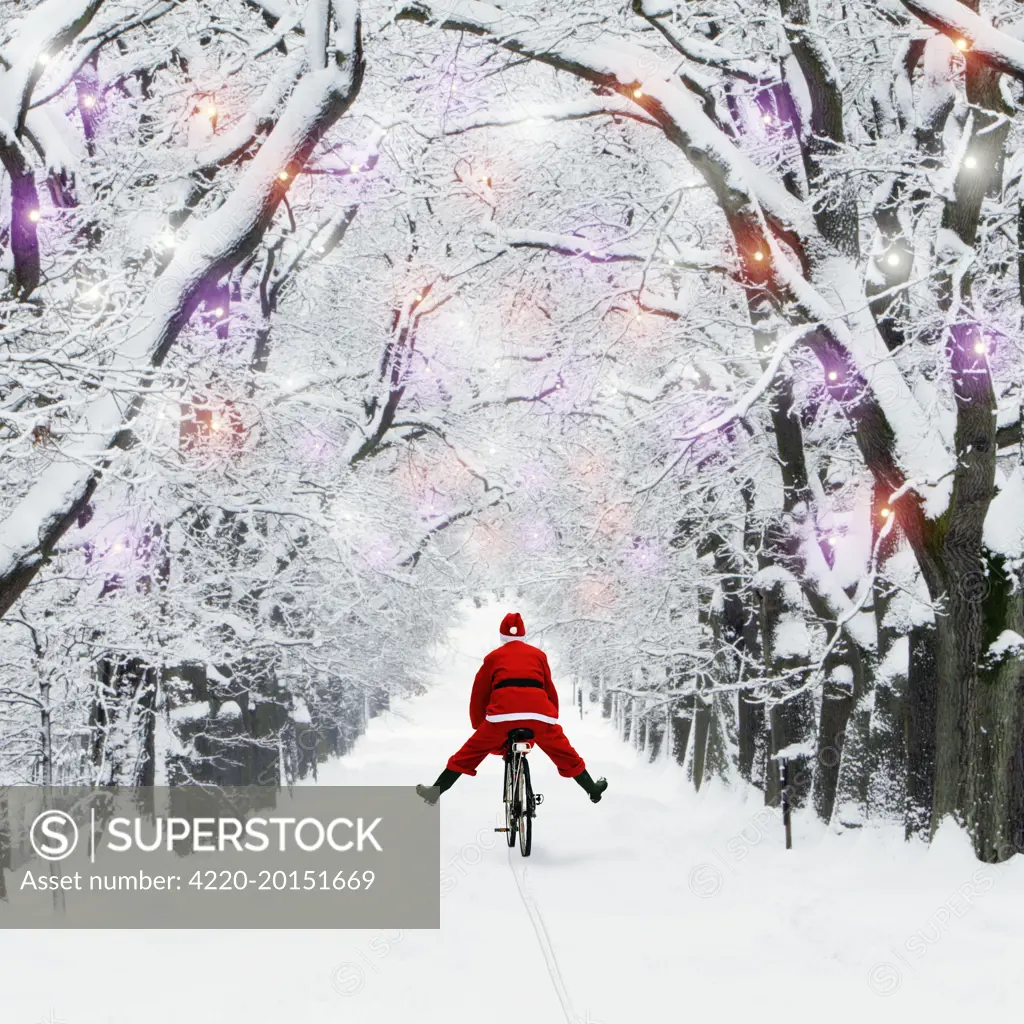 Father Christmas riding through avenue in winter snow with Christmas lights. 