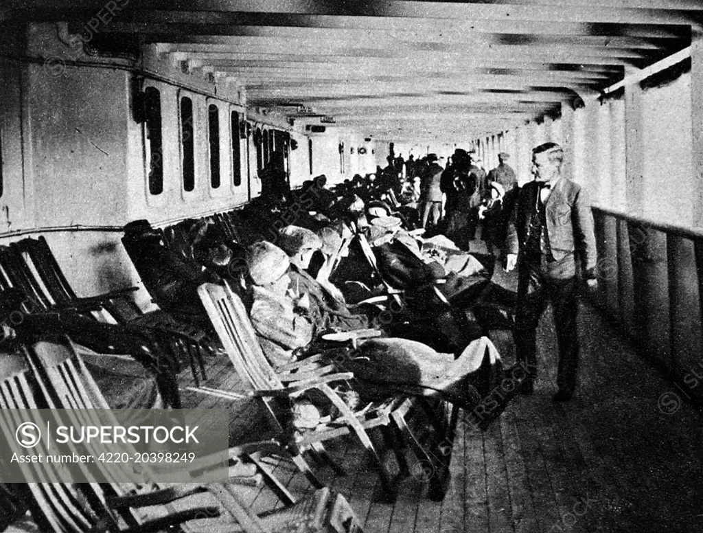 The promenade deck of the 'Lusitania' showing passengers reclining on deck-chairs.  The Lusitania was torpedoed by a German U-boat on May 7th 1915 with the loss of 1210 lives.     Date: May 15th 1915.