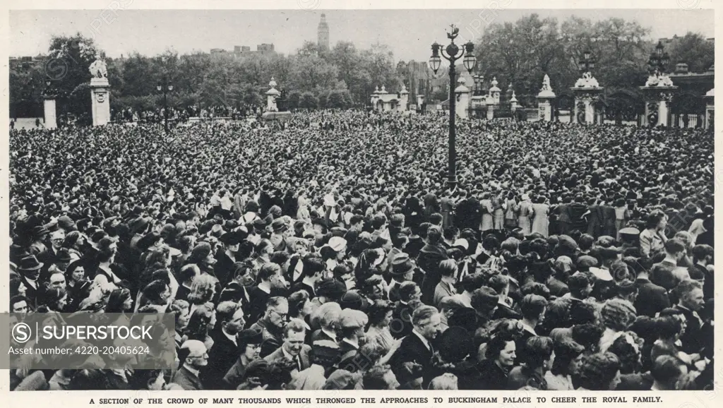 Crowds to welcome King George VI and Queen Mary as they appeared on the balcony of Buckingham Palace on May 8th 1945 (VE Day).  The King and Queen would later be joined on the balcony by Winston Churchill.     Date: May 19th 1945