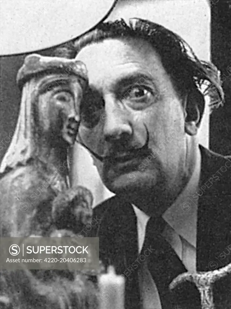 The surrealist artist, Salvador Dali (1904-1989), was photographed with a statuette of the Madonna and Child during a visit to London in 1959.  At the time Fleur Cowles was writing a book about him.     Date: 03/06/1959