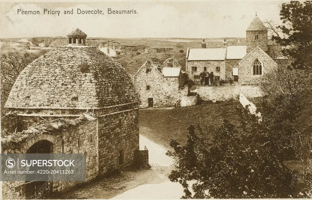 Penmon Priory and Dovecote, Beaumaris, Wales. Penmon is a promontory, parish and community on the south-east tip of Anglesey, North Wales, about three miles east of the town of Beaumaris. It is the site of an historic monastery and associated 12th century church. Walls near the well next to the church may be part of the oldest remaining Christian building in Wales.     Date: circa 1910s