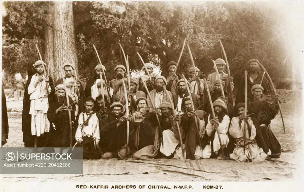 The Khyber Pass - the mountain pass that links Pakistan and Afghanistan. Throughout history it has been an important trade route between Central Asia and South Asia and a strategic military location. This card date from the conclusion of the third Anglo-Afghan war of 1919. The Red Kaffir Archers of Chitral of the North West Frontier Province.  circa 1920