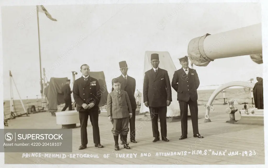 HIH Prince Sehzade Mehmed Ertugrul Efendi (1912-1944) - the last crown prince of the Ottoman Empire. Removed from Turkey by the British following the fall of the Sultanate and pictured here with his attendants on the deck of the British naval vessel HMS Ajax.  January 1923