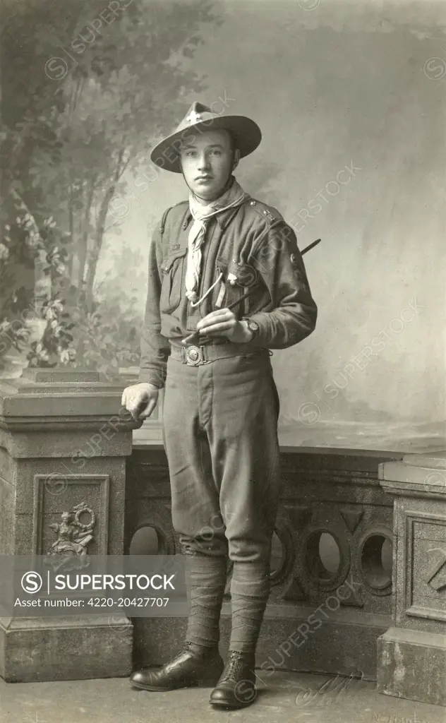 Full length portrait of a scout in uniform.   