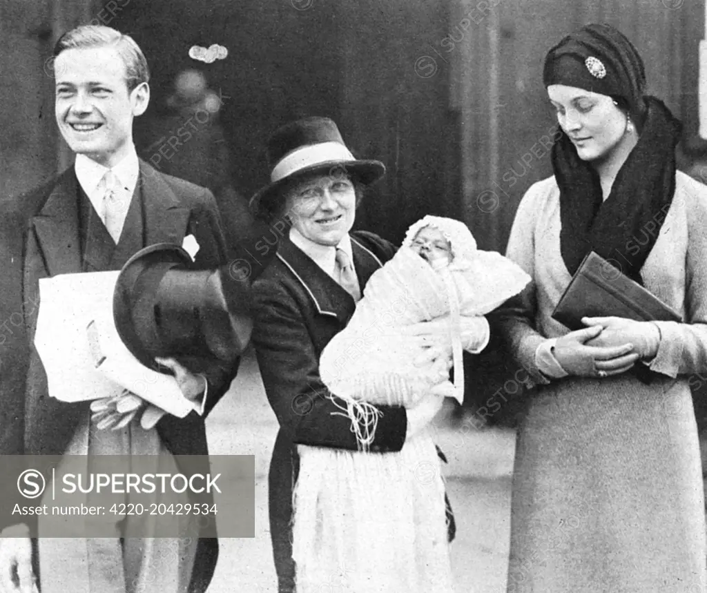 Mr and the Hon. Mrs Bryan Guiness (the former Diana Freeman Mitford), pictured at the christening of their elder son, Jonathan Bryan, at St. Margaret's, Westminster.  His godparents were Evelyn Waugh, Randolph Churchill, Peregrine Willoughby, Cecilia Keppel and Miss Rosemary Mitford.  The baby is seen being held by his nurse.       Date: 1930