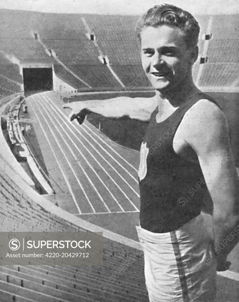 Frank Clifford Wyckoff (1909 1980) was an American athlete and triple gold medal winner in 4x100 m relay at the Olympic Games in 1924, 1928 and 1932.  Pictured here pointing to the scene of the 'Olympic pageant'.         Date: 1932