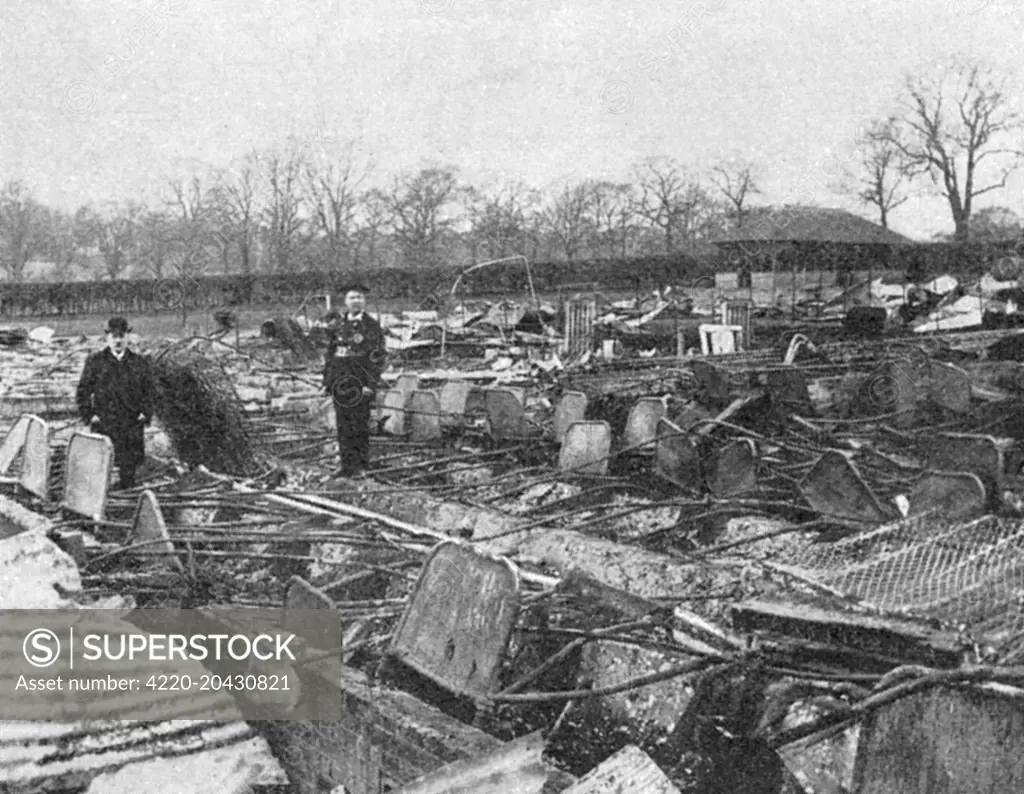 The ruins of the temporary annexe at the Middlesex Pauper Lunatic Asylum at Colney Hatch, near Friern Barnet, Middlesex (North London), following the disasterous fire there in 1903. 51 patients perished, but more might have been saved, claims the text in the Illustrated London News that accompanies this picture, had not the unfortunate inmates rushed towards the flames instead of away from them.     Date: 1903