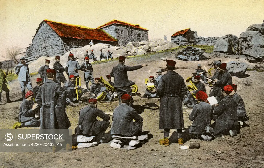 The Macedonian Campaign of 1917 - The Band in the Encampment. The Macedonian Front (or Salonika front) of World War I was formed as a result of an attempt by the Allied Powers to aid Serbia, in the autumn of 1915, against the combined attack of Germany, Austria-Hungary and Bulgaria. This card appears to show a group of Bulgarian troops.     Date: 1917