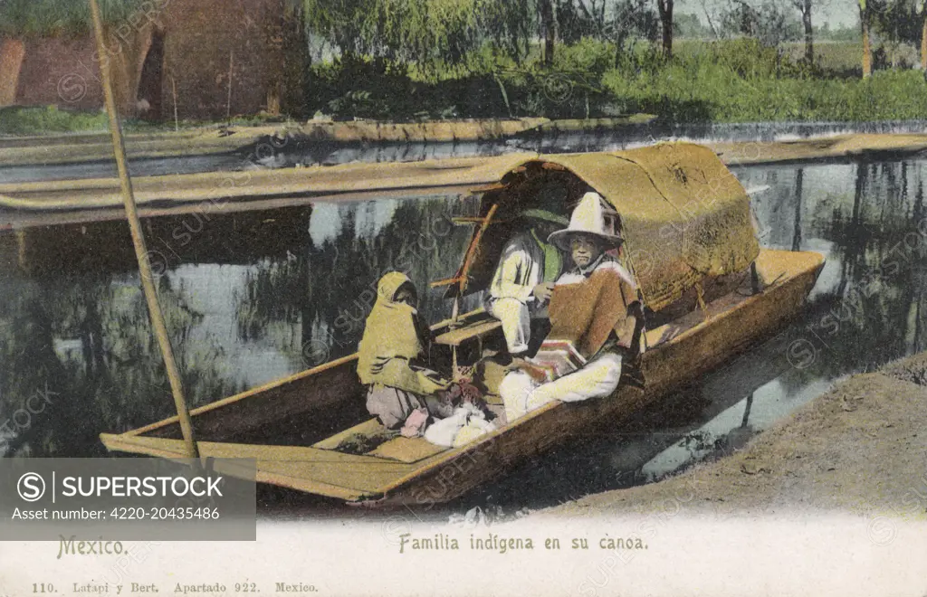 Indigenous Family on their canoe, Mexico     Date: 1910s