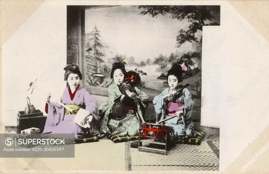 Japan - Three Geisha Girls playing traditional instruments - two on drums and one playing the Shamisen.     Date: circa 1904