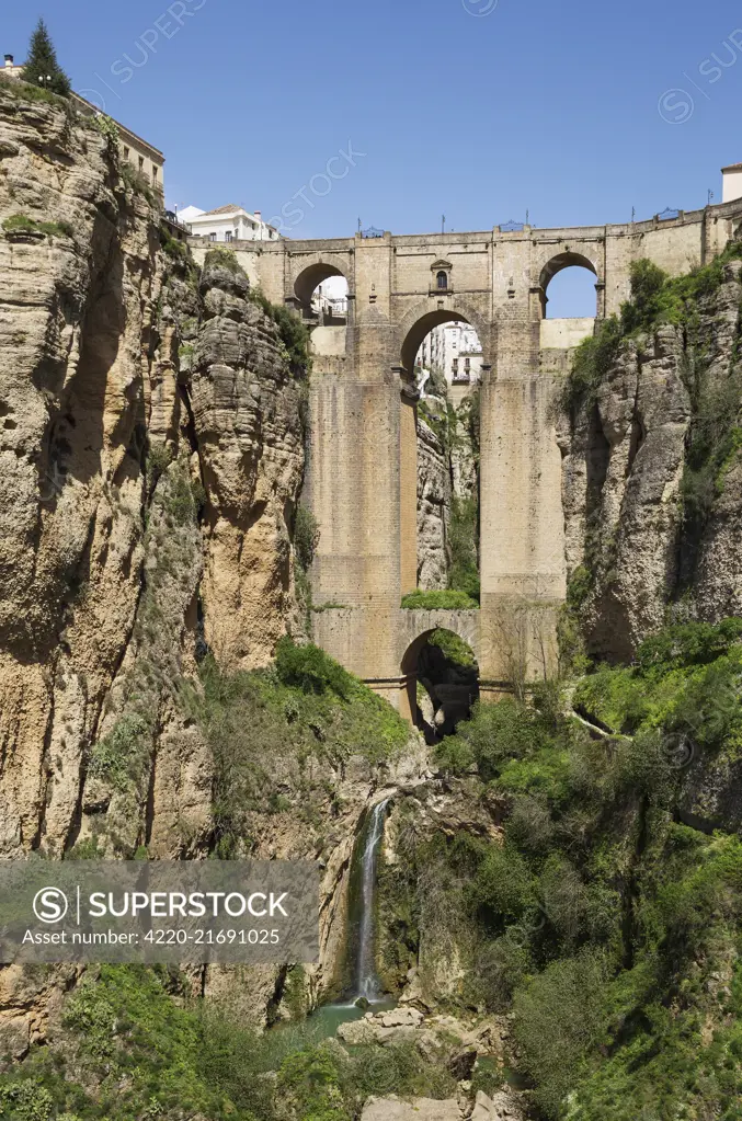 The White Town of Ronda high above the river gorge El Tajo   the river itself is called Guadalevin   Malaga province, Andalusia, Spain     Date: 