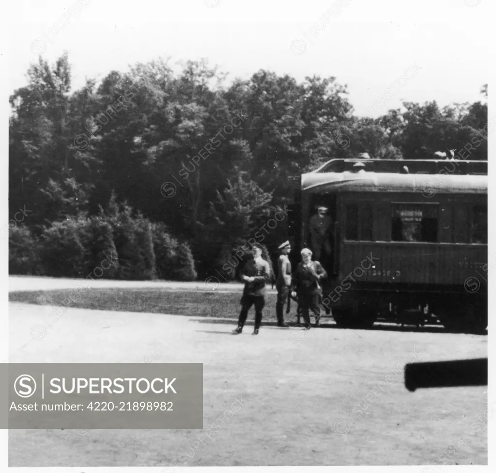 Hitler and Goering leaving the  train carriage where the  negotiations for the surrender  of France have taken place.        Date: 1940