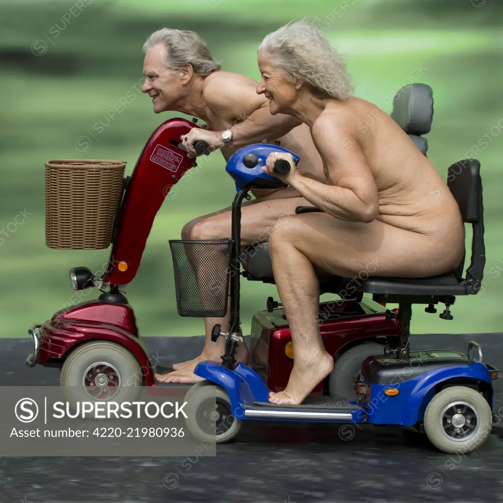 NUDE. older couple having a race on mobility scooters Date: - SuperStock