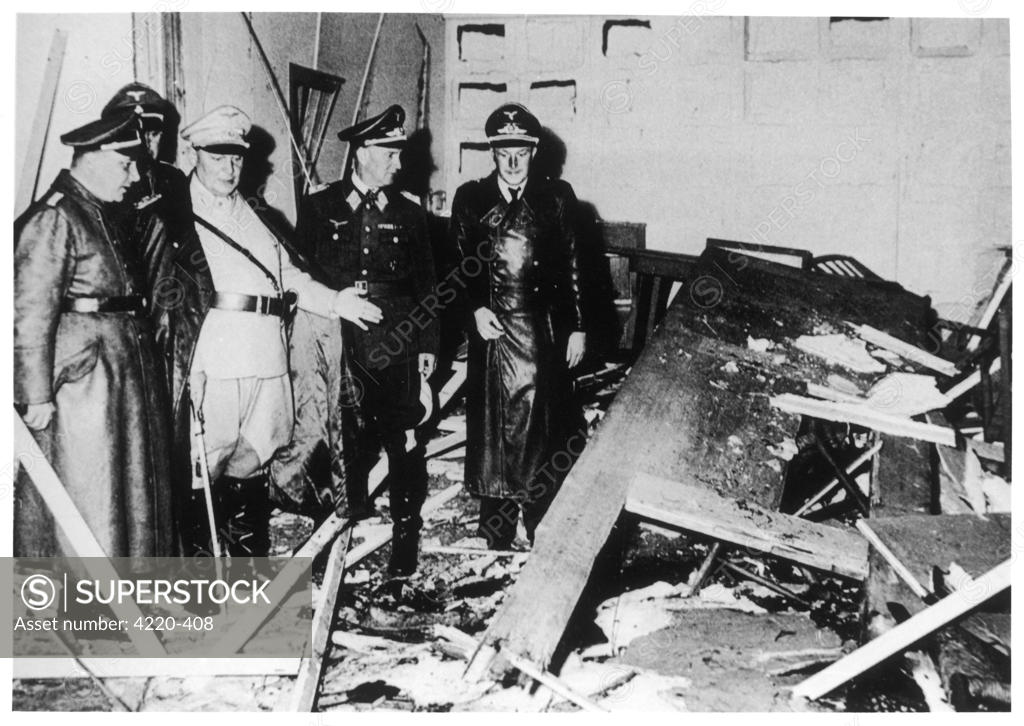 Hermann Goering (in white) showing officials the wreckage following the ...