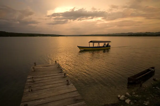 Guatemala - Flores Lake &amp; pontoon at sunset 