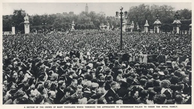 Crowds to welcome King George VI and Queen Mary as they appeared on the balcony of Buckingham Palace on May 8th 1945 (VE Day).  The King and Queen would later be joined on the balcony by Winston Churchill.     Date: May 19th 1945