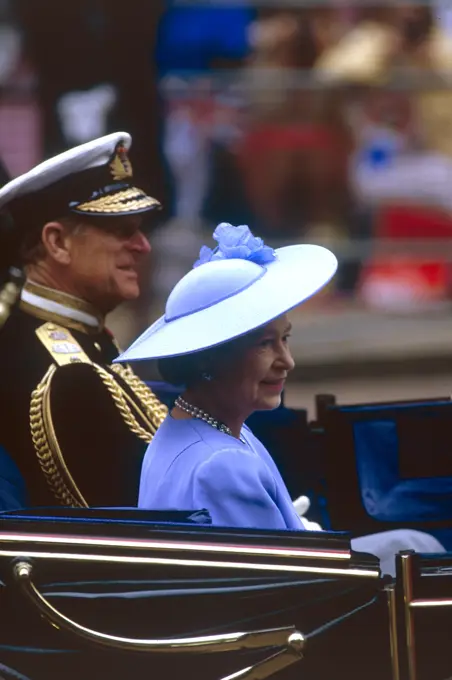 Queen Elizabeth II, travel with Prince Philip, Duke of Edinburgh in an open top carriage to Westminster Abbey for the marriage of their son, Prince Andrew, Duke of York on 23 July 1986.     Date: 1986