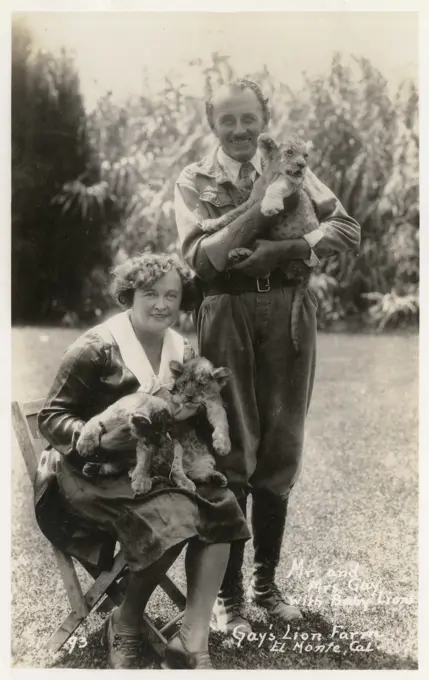 Gay's Lion Farm, El Monte, California, USA, showing Mr and Mrs Gay with lion cubs.   20th century