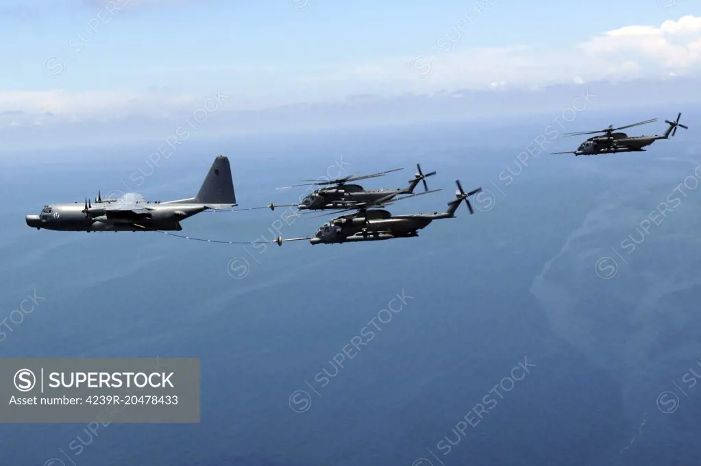 June 12, 2008 - Two MH-53 Pave Low helicopters from Hurlburt Field, Florida, get refueled by an MC-130H during the last five-ship formation of the 20th Special Operations Squadron.